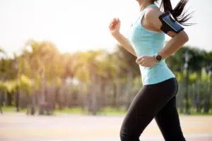 Woman with a flat and tight abdomen after a tummy tuck.