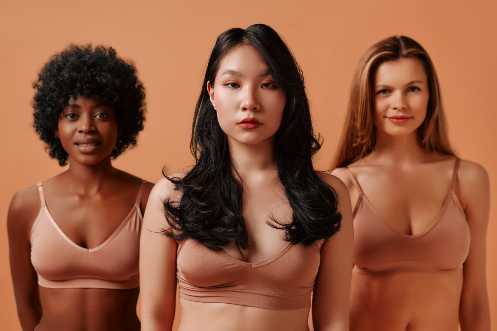 Multiethnic women on beige background