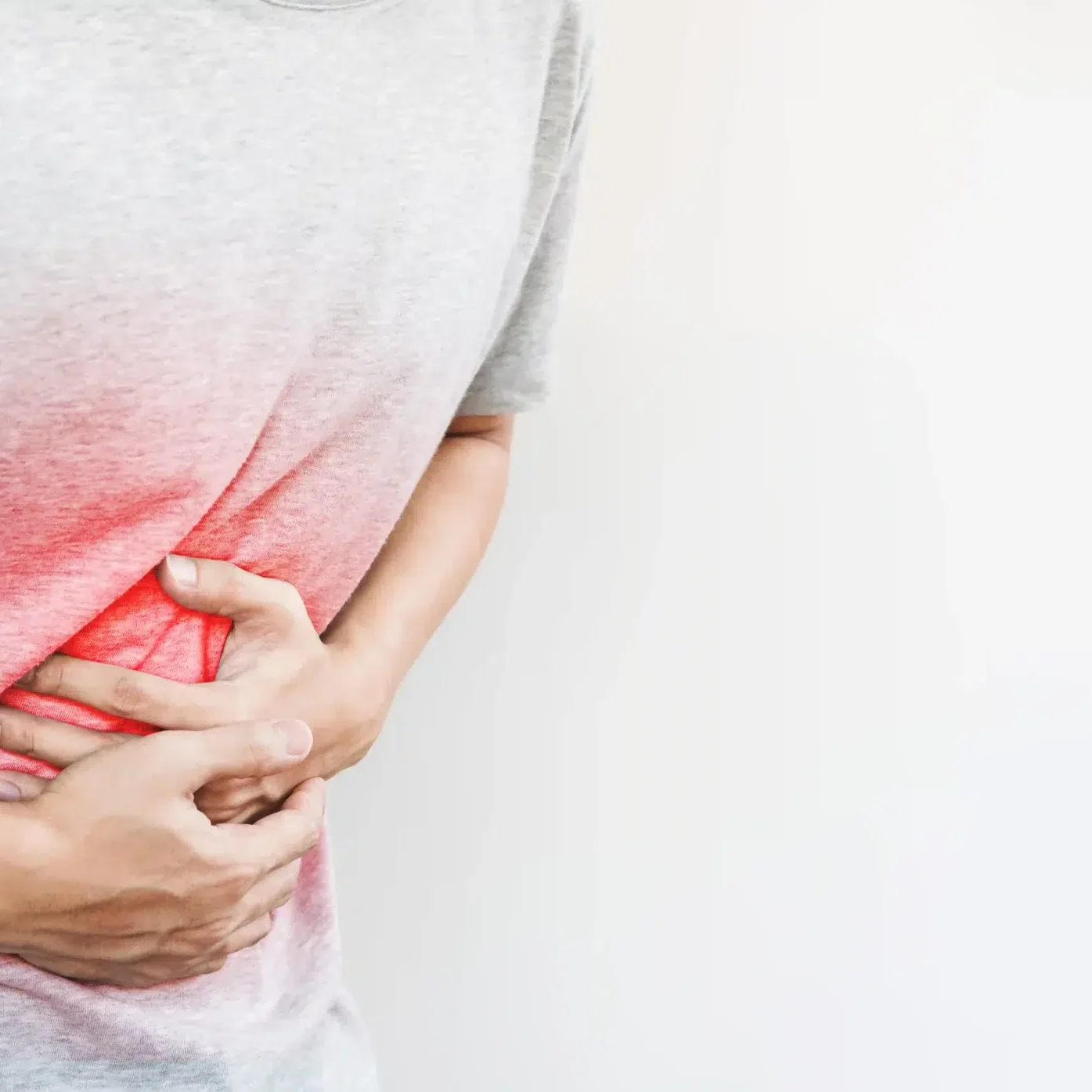 Person experiencing pain due to an umbilical hernia